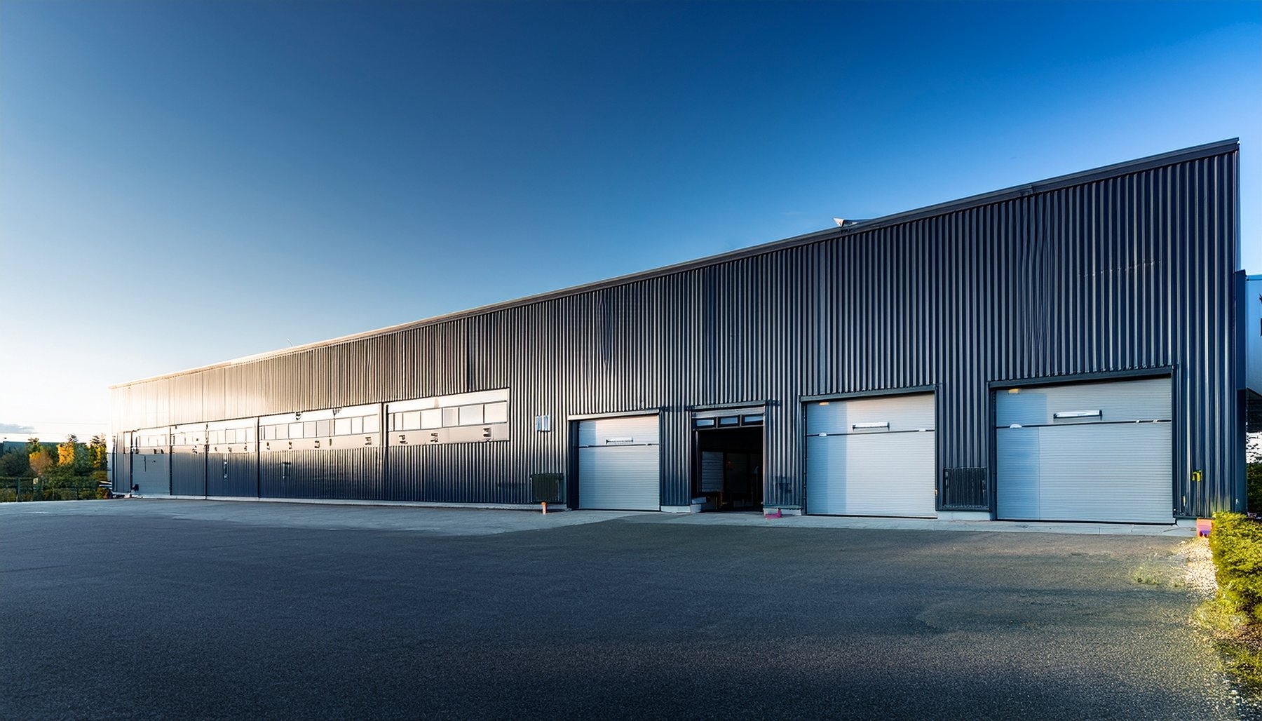 Long small bay industrial building with multiple drive-in bays on Long Island